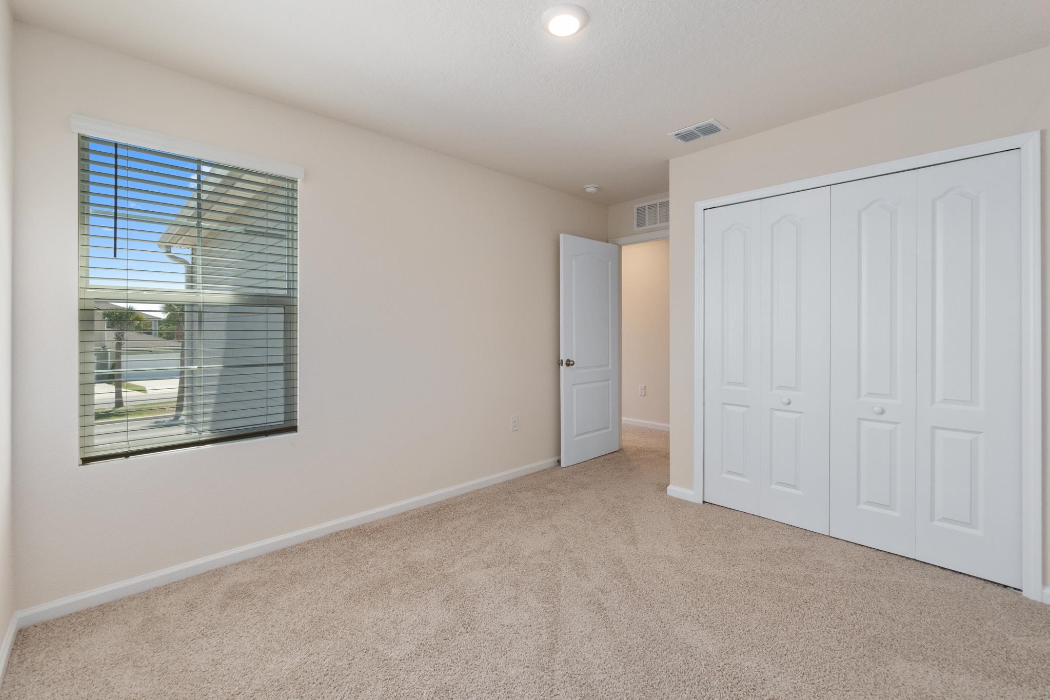 196 Redbud Road Palm Coast, FL 32137 - Photo 29 of 41 a view of an empty room with a window