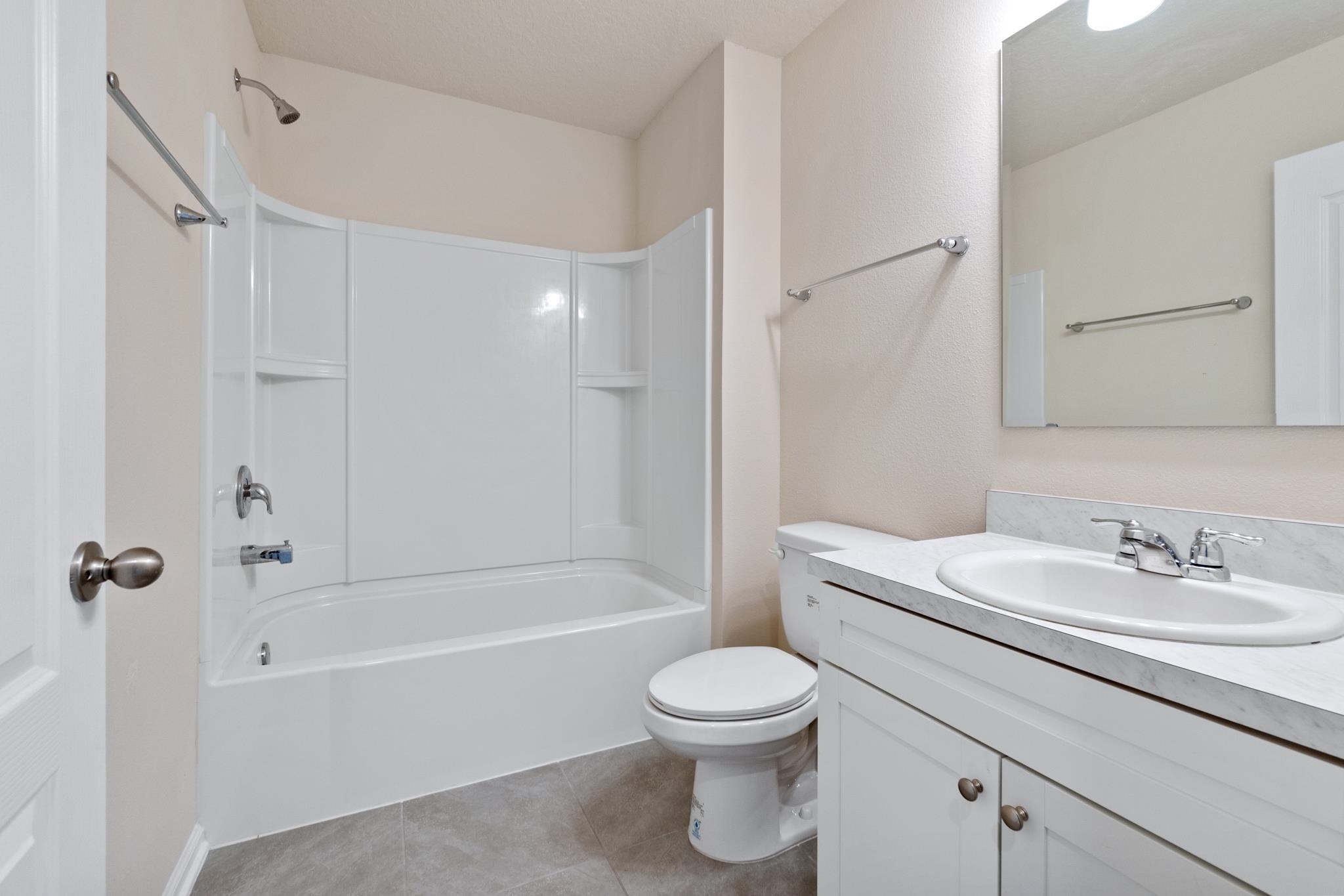 196 Redbud Road Palm Coast, FL 32137 - Photo 33 of 41 a bathroom with a sink toilet and shower