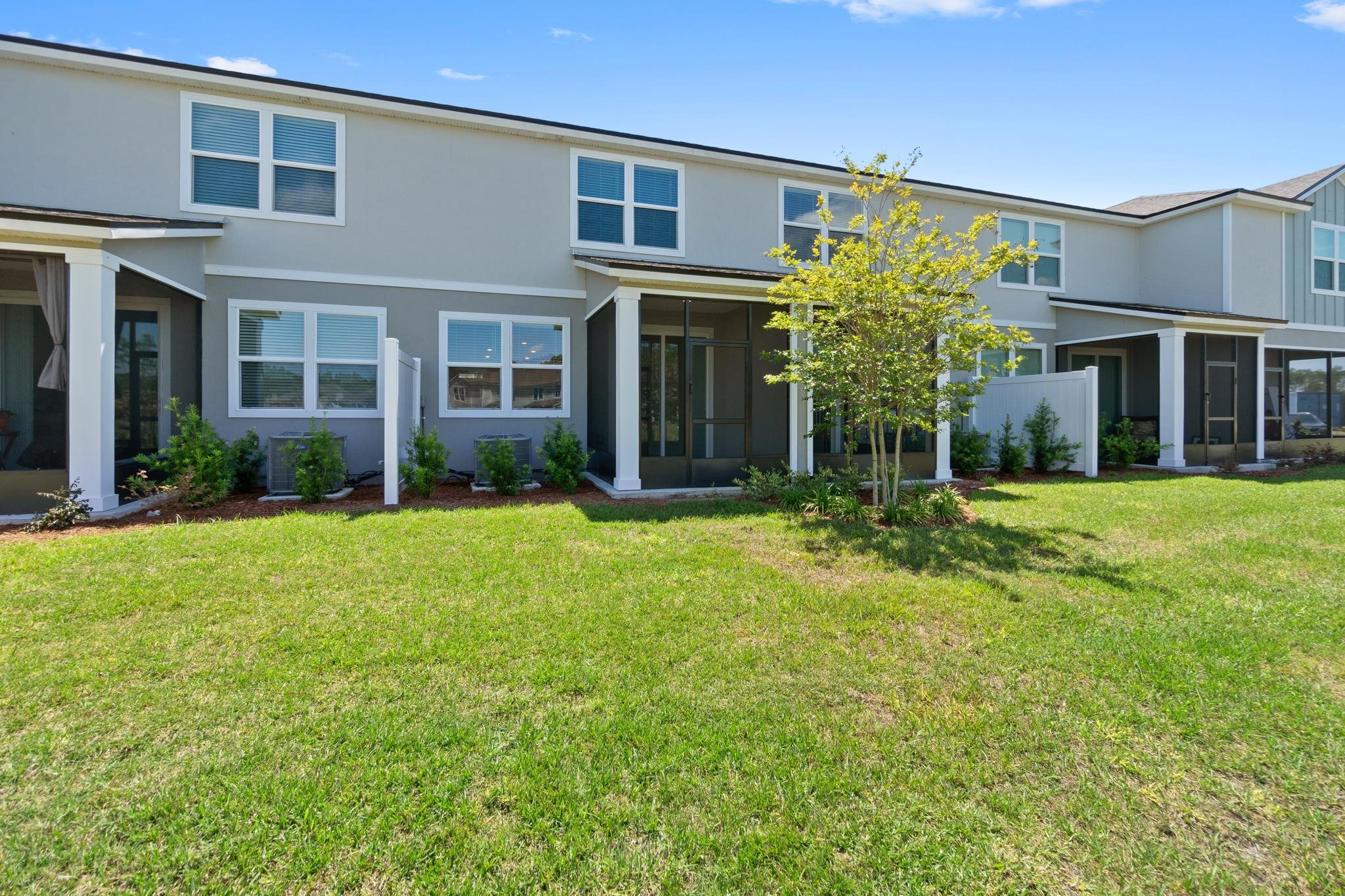 196 Redbud Road Palm Coast, FL 32137 - Photo 36 of 41 front view of a brick house with a yard