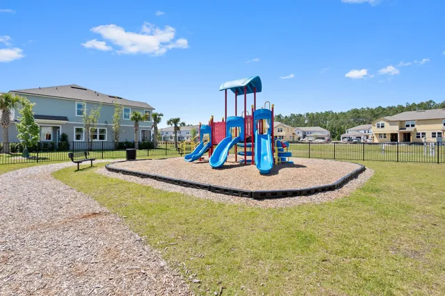 a view of a swimming pool with a yard