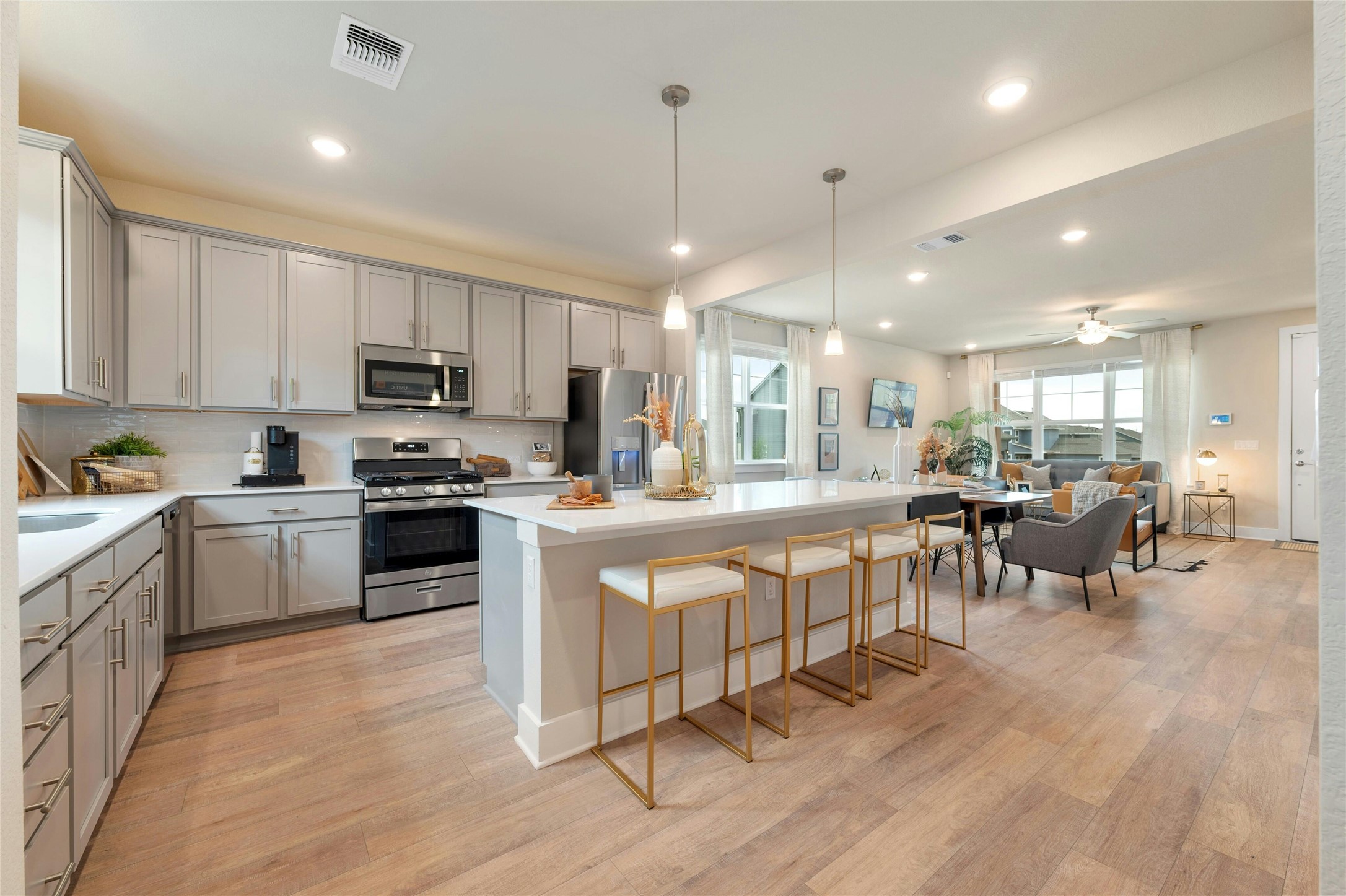 5804 Rotunda View Austin, TX 78747 - Photo 9 of 27 Prepare meals in this modern kitchen with sleek cabinetry and a convenient island, flowing seamlessly into the inviting living area.