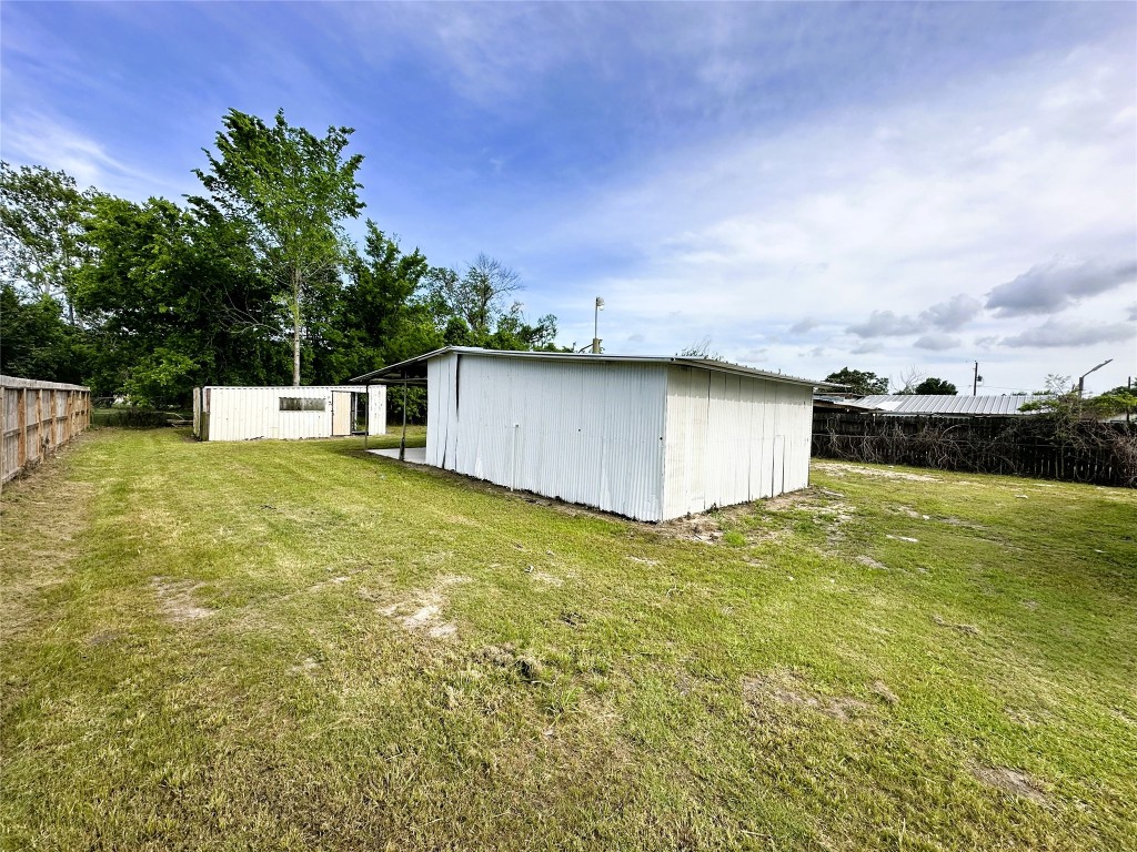 207 South 5th Street Highlands, TX 77562 - Photo 12 of 15 a view of a large pool with a yard