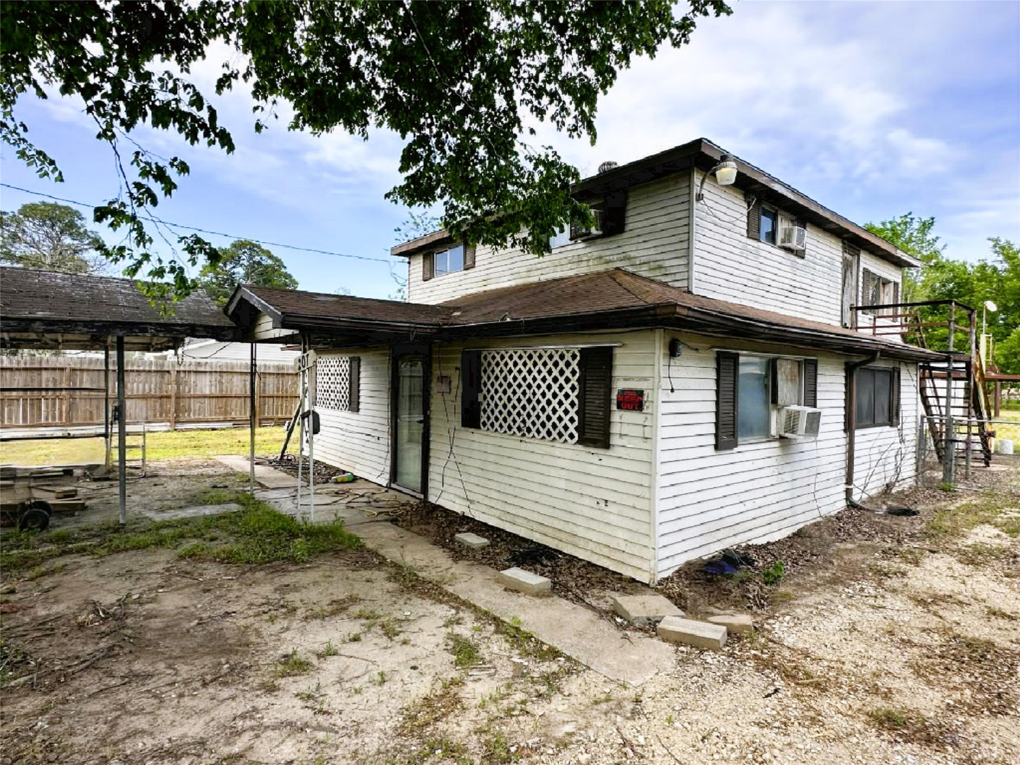 207 South 5th Street Highlands, TX 77562 - Photo 3 of 15 a view of a white house with large windows