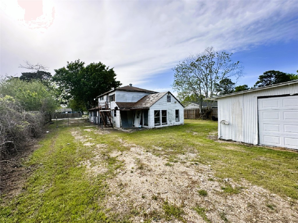 207 South 5th Street Highlands, TX 77562 - Photo 10 of 15 a view of a house with a yard and sitting area