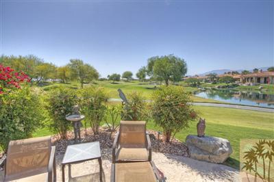 54 Vía Bella Rancho Mirage, CA 92270 - Photo 1 of 25 a view of a lake with couches in front of house