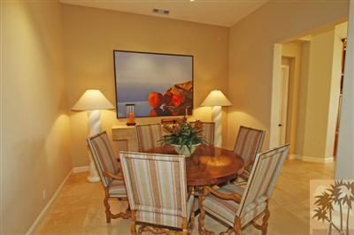 54 Vía Bella Rancho Mirage, CA 92270 - Photo 14 of 25 a view of a dining room with furniture and wooden floor