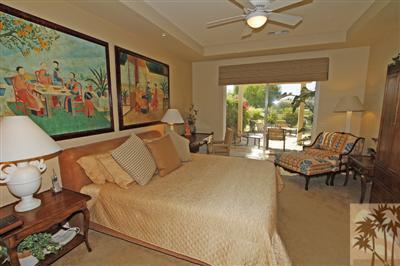 54 Vía Bella Rancho Mirage, CA 92270 - Photo 15 of 25 a bedroom with furniture and a large window