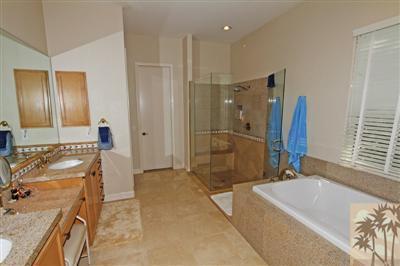 54 Vía Bella Rancho Mirage, CA 92270 - Photo 16 of 25 a bathroom with a tub sink and mirror