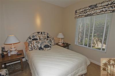 54 Vía Bella Rancho Mirage, CA 92270 - Photo 19 of 25 a bedroom with a bed and a window