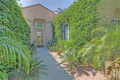 54 Vía Bella Rancho Mirage, CA 92270 - Photo 4 of 25 a front view of a house with a yard