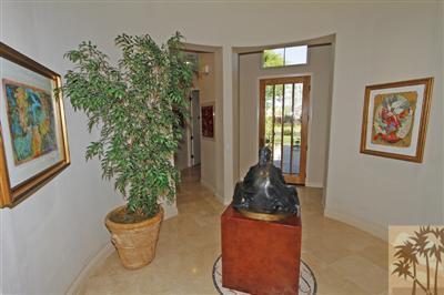 54 Vía Bella Rancho Mirage, CA 92270 - Photo 5 of 25 a room with wooden floor and potted plant