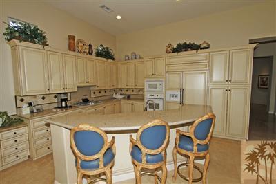 54 Vía Bella Rancho Mirage, CA 92270 - Photo 8 of 25 a dining table with chairs and wooden floor
