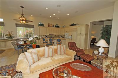 54 Vía Bella Rancho Mirage, CA 92270 - Photo 9 of 25 a living room with furniture and a chandelier