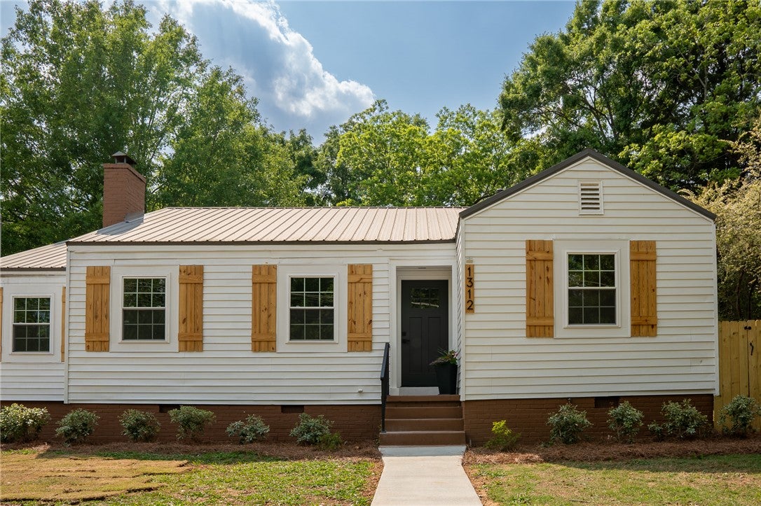 1312 Rocky Brook Road Opelika, AL 36801 - Photo 45 of 45 This charming residence features classic siding and a welcoming entryway, offering comfort and style.