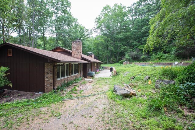 869 Union Church Road Churchville, VA 24421 - Photo 24 of 31 a backyard of a house with plants and large trees