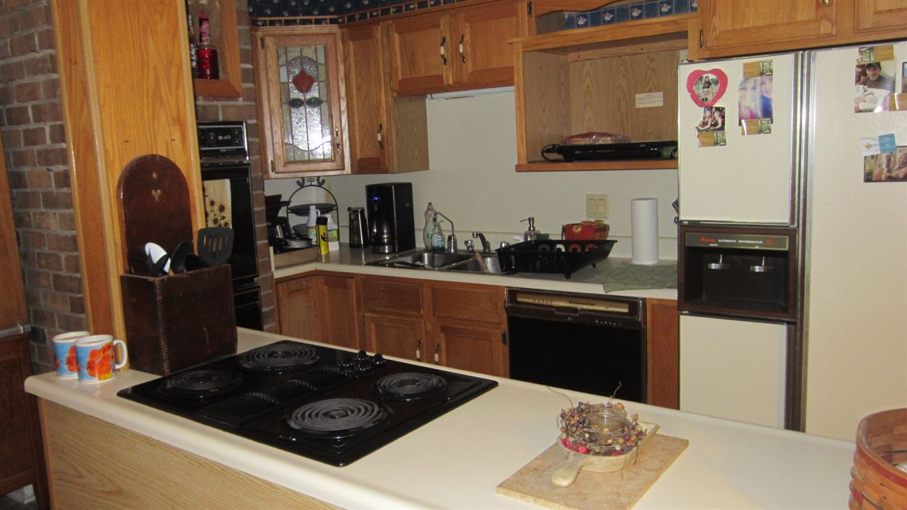 869 Union Church Road Churchville, VA 24421 - Photo 3 of 31 a kitchen with a refrigerator and a stove top oven