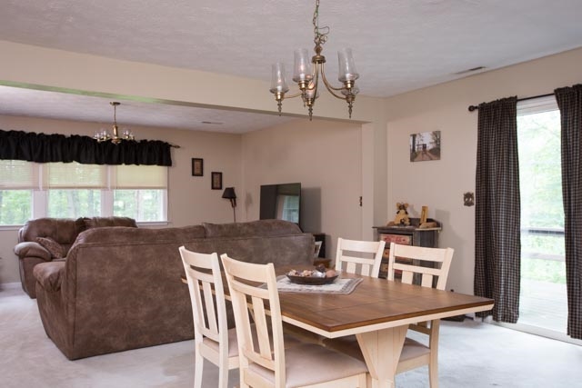 869 Union Church Road Churchville, VA 24421 - Photo 5 of 31 a living room with furniture and a chandelier