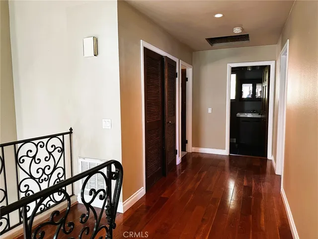 a view of an entryway with wooden floor
