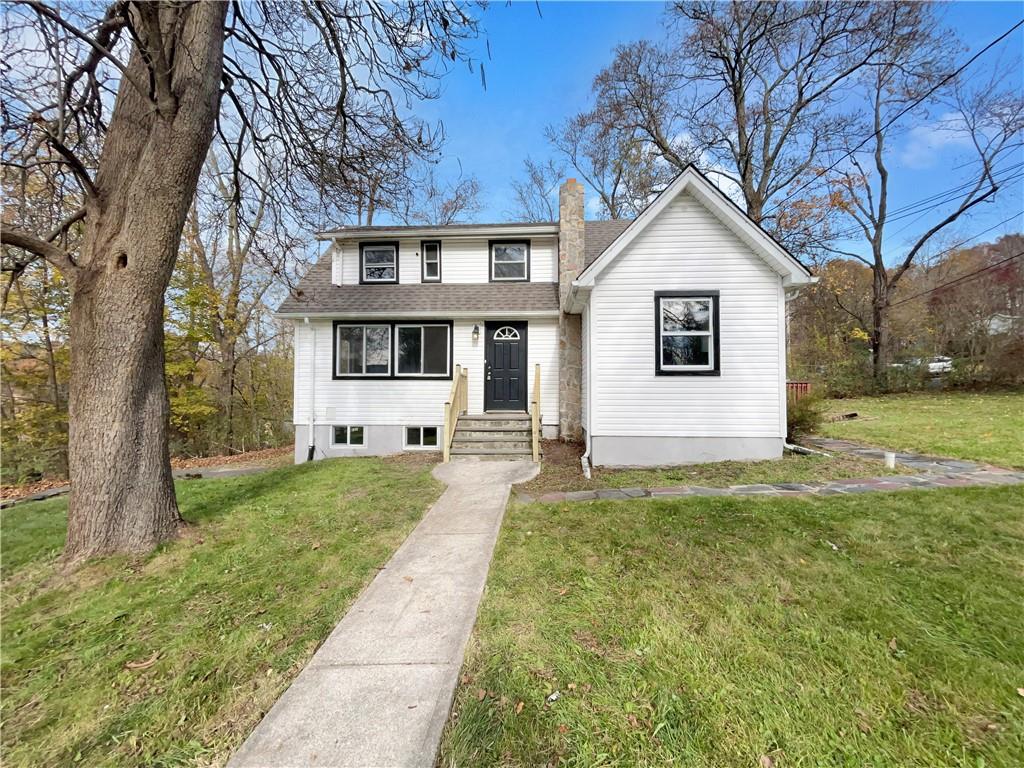 39 Center Hill Road Monroe, NY 10950 - Photo 1 of 1 a front view of a house with a yard