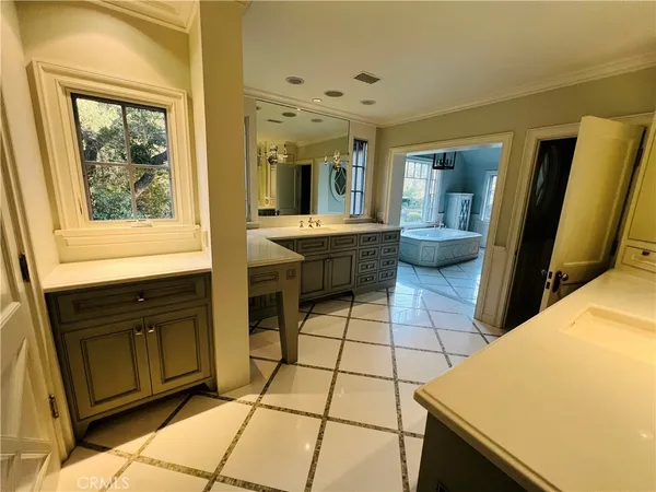 a kitchen with stainless steel appliances a sink and a refrigerator