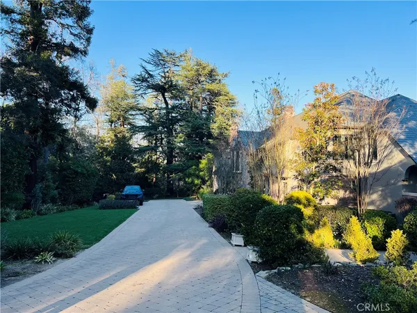 a view of a garden with a building in the background