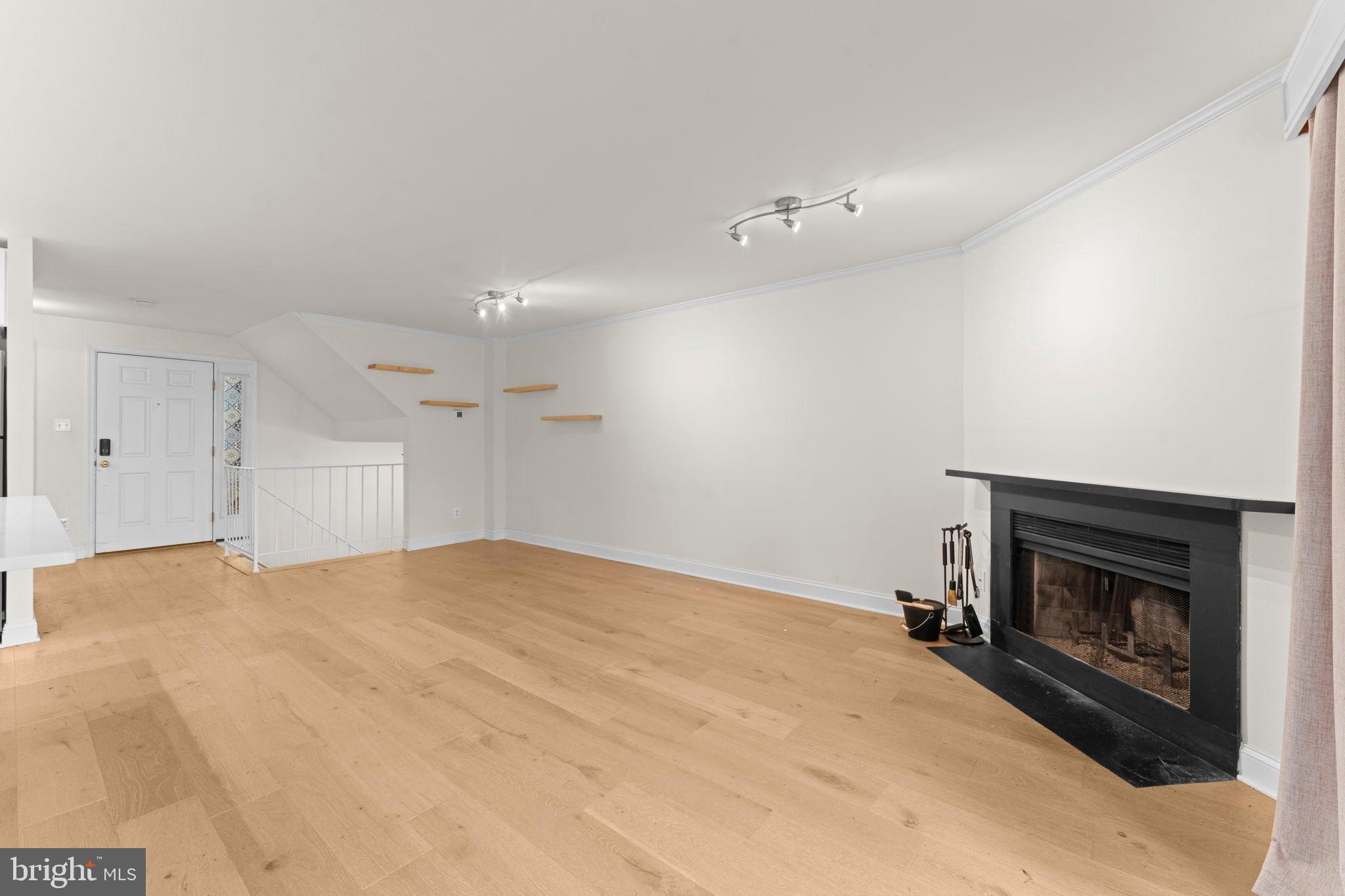 2105 North Rolfe Street, Unit A Arlington, VA 22209 - Photo 13 of 56 a big room with a fireplace