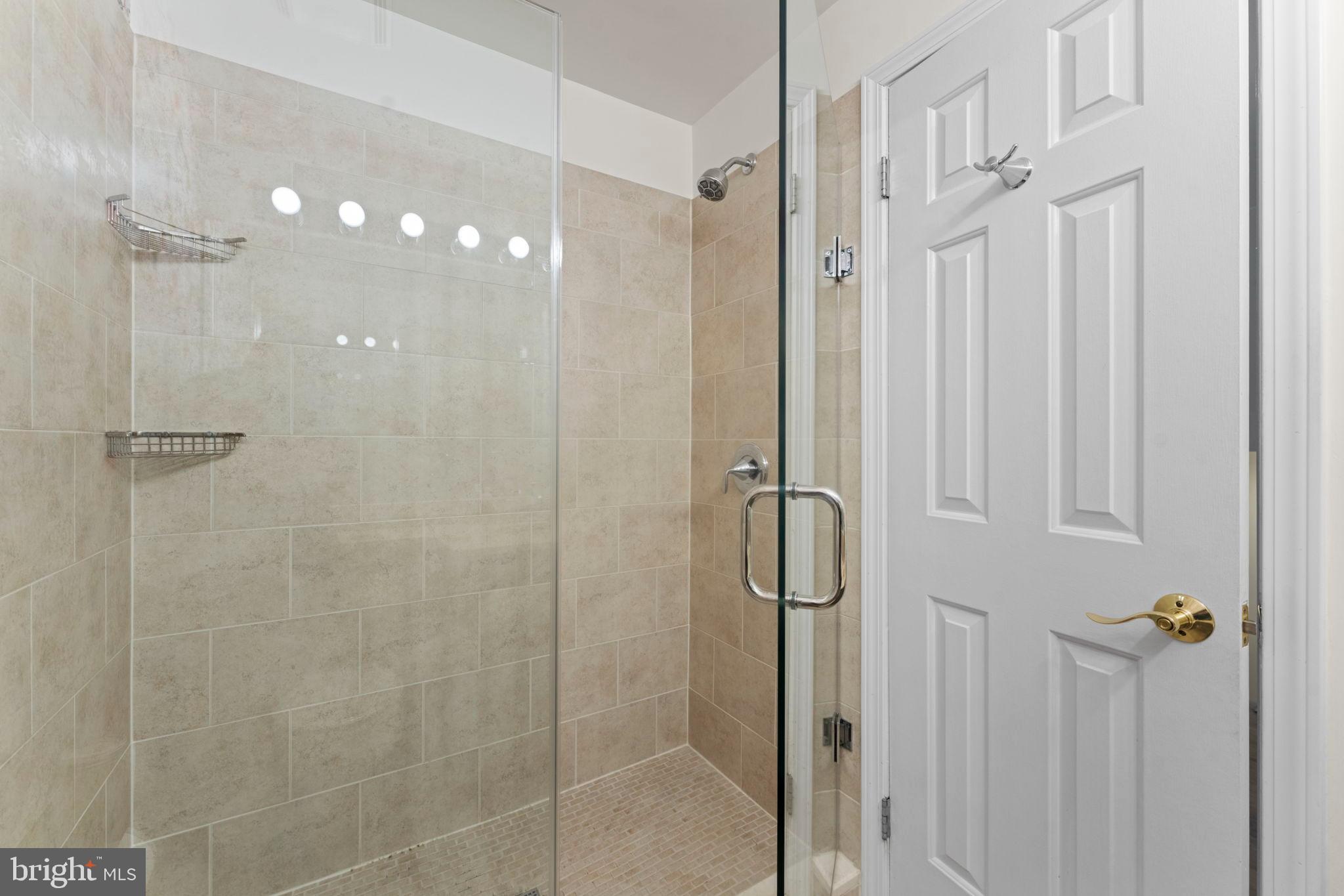 2105 North Rolfe Street, Unit A Arlington, VA 22209 - Photo 17 of 56 a bathroom with a shower