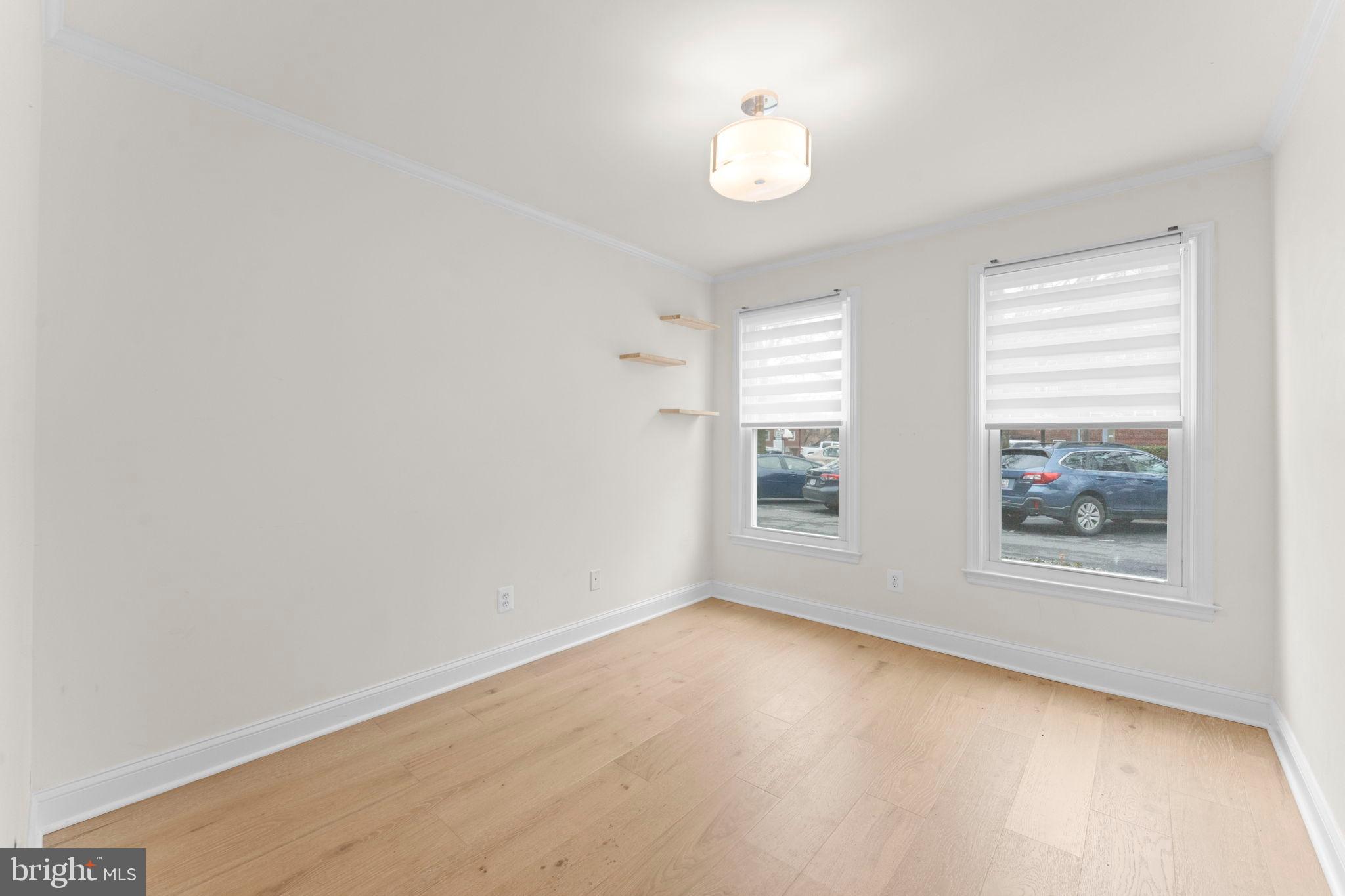 2105 North Rolfe Street, Unit A Arlington, VA 22209 - Photo 18 of 56 an empty room with windows