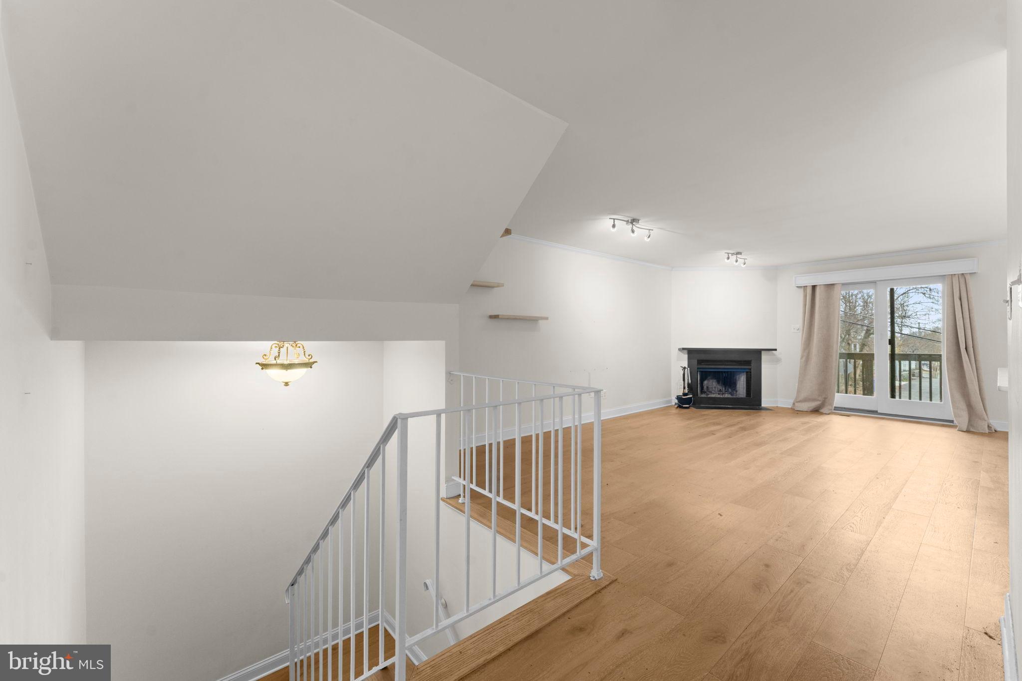 2105 North Rolfe Street, Unit A Arlington, VA 22209 - Photo 20 of 56 a view of main area with wooden floor and windows