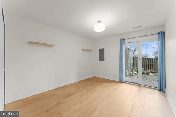 a view of an empty room and a window