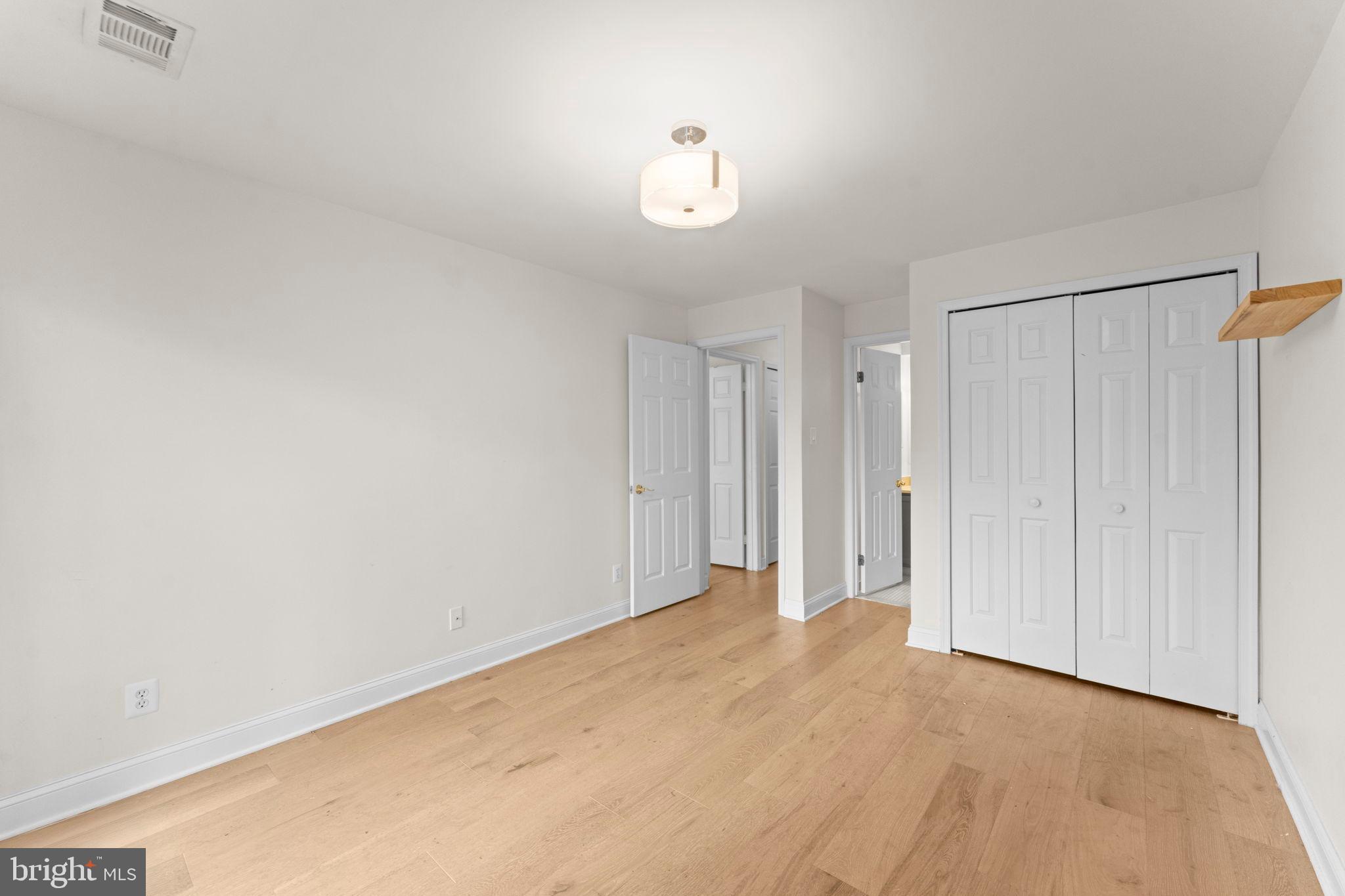 2105 North Rolfe Street, Unit A Arlington, VA 22209 - Photo 24 of 56 a view of an empty room and a window