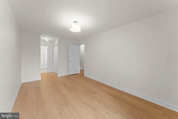 a view of a bedroom from the hallway