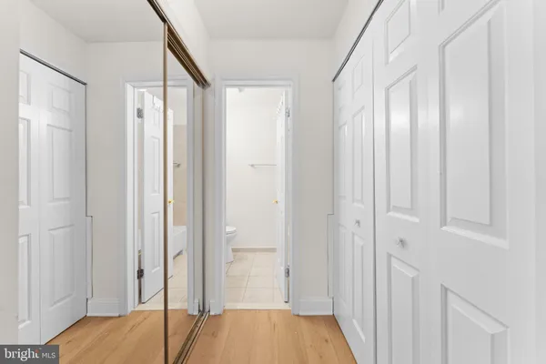 a view of walk in closet with empty racks