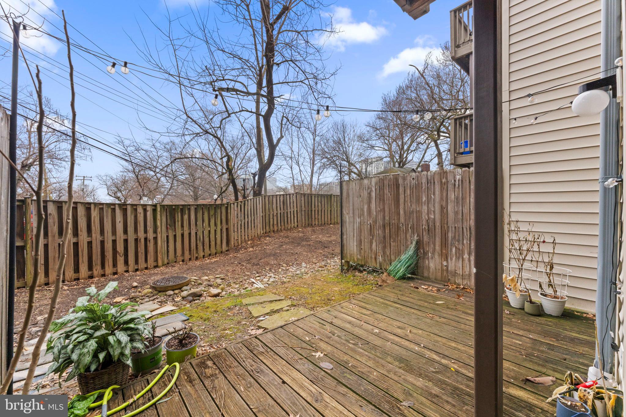 2105 North Rolfe Street, Unit A Arlington, VA 22209 - Photo 33 of 56 a view of backyard with wooden fence