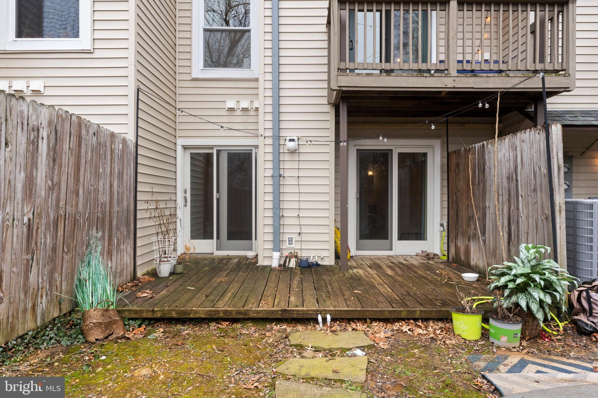 2105 North Rolfe Street, Unit A Arlington, VA 22209 - Photo 34 of 56 a front view of a house with a yard