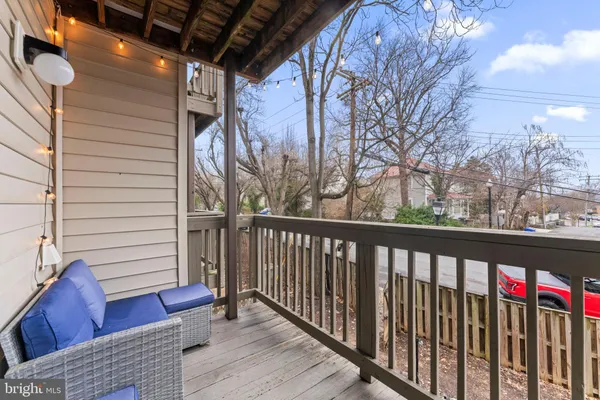 a view of a balcony with wooden floor