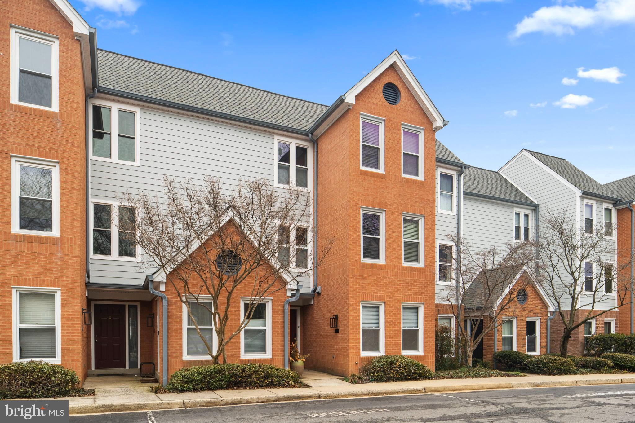 2105 North Rolfe Street, Unit A Arlington, VA 22209 - Photo 37 of 56 a front view of a house with a yard