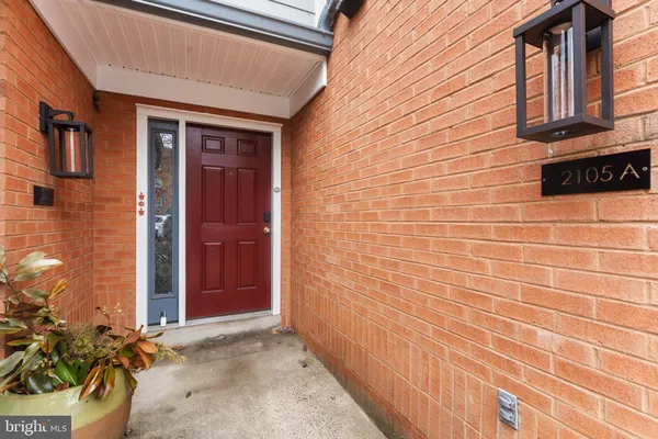a view of a brick house with a street