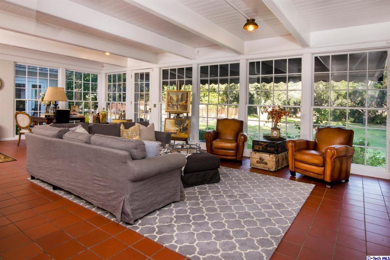 1814 Midlothian Drive Altadena, CA 91001 - Photo 11 of 42 a living room with furniture and large windows