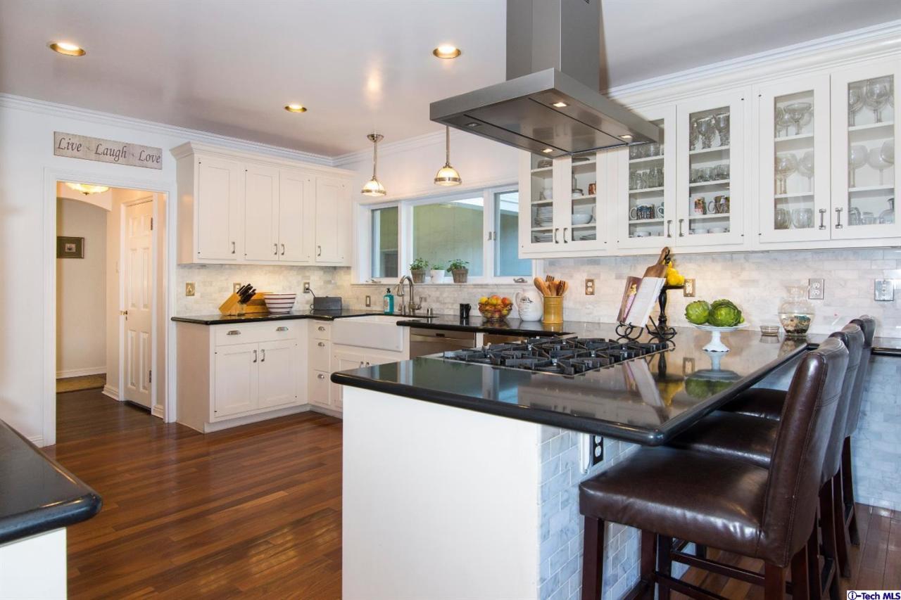 1814 Midlothian Drive Altadena, CA 91001 - Photo 14 of 42 a kitchen with stainless steel appliances granite countertop a sink and a refrigerator