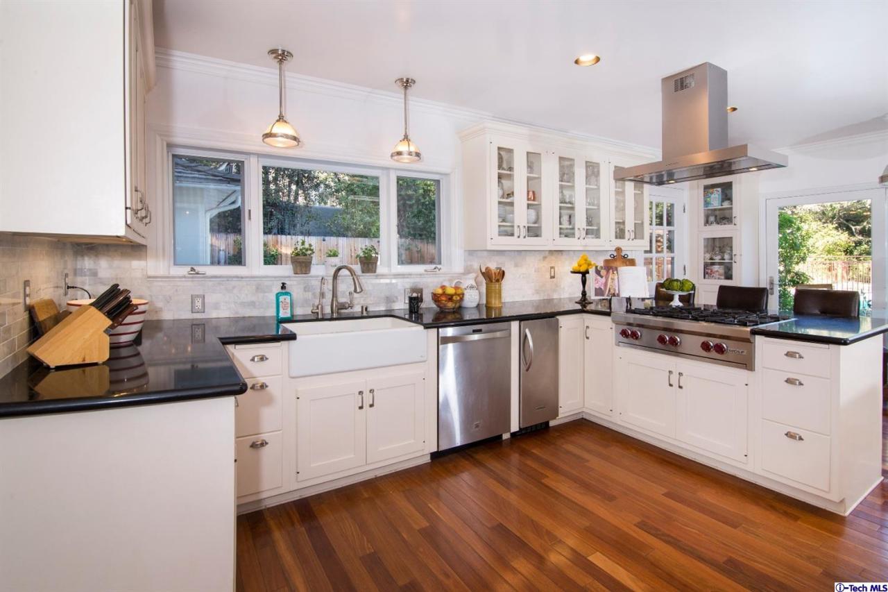 1814 Midlothian Drive Altadena, CA 91001 - Photo 15 of 42 a kitchen with wooden floors and white appliances