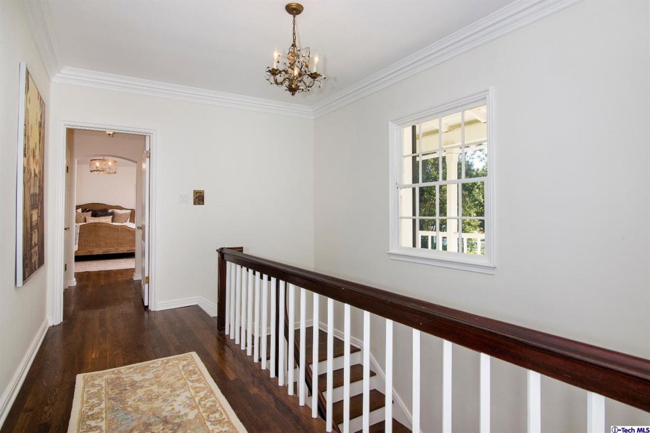 1814 Midlothian Drive Altadena, CA 91001 - Photo 19 of 42 a view of a hallway view with wooden floor and staircase