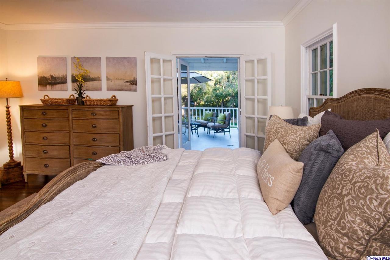 1814 Midlothian Drive Altadena, CA 91001 - Photo 21 of 42 a bedroom with a bed and wooden floor