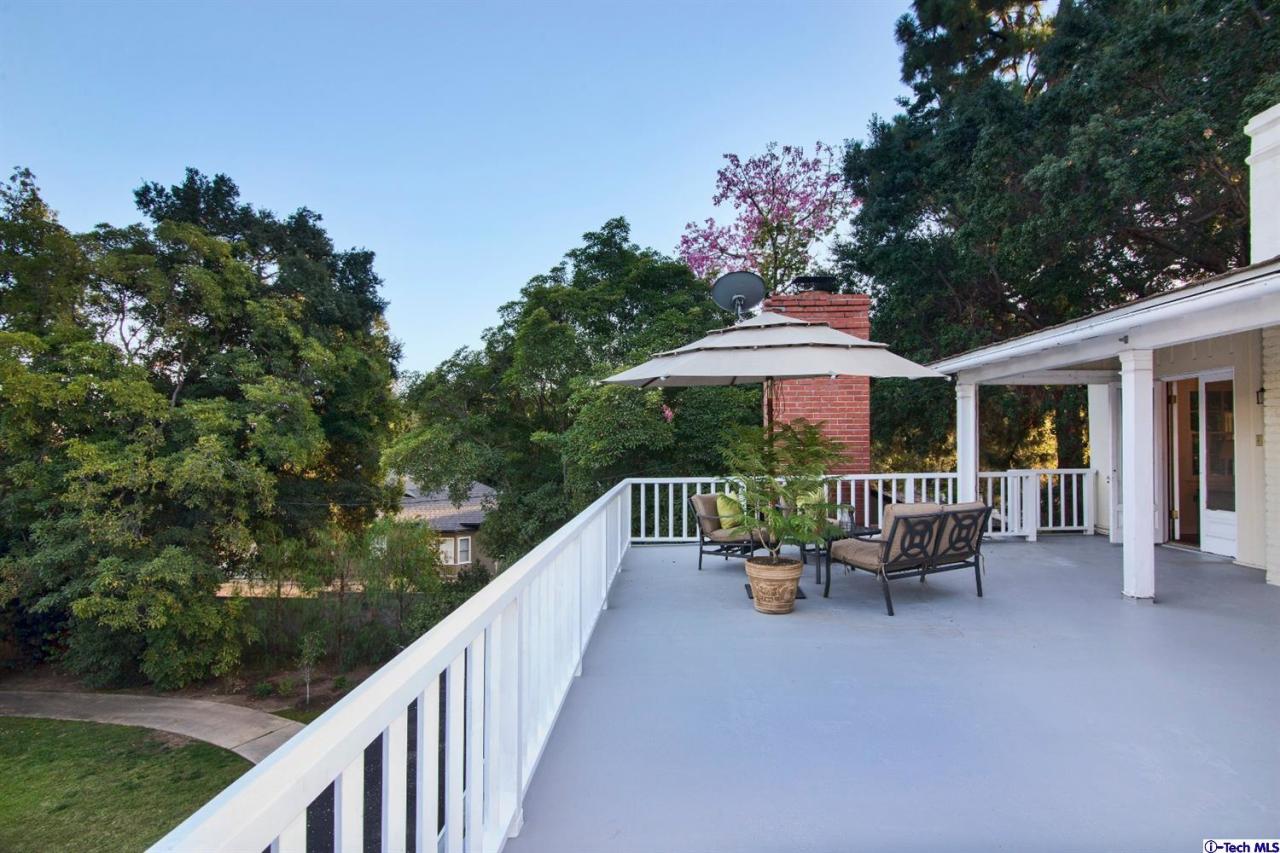 1814 Midlothian Drive Altadena, CA 91001 - Photo 25 of 42 a deck with hardwood table and chairs