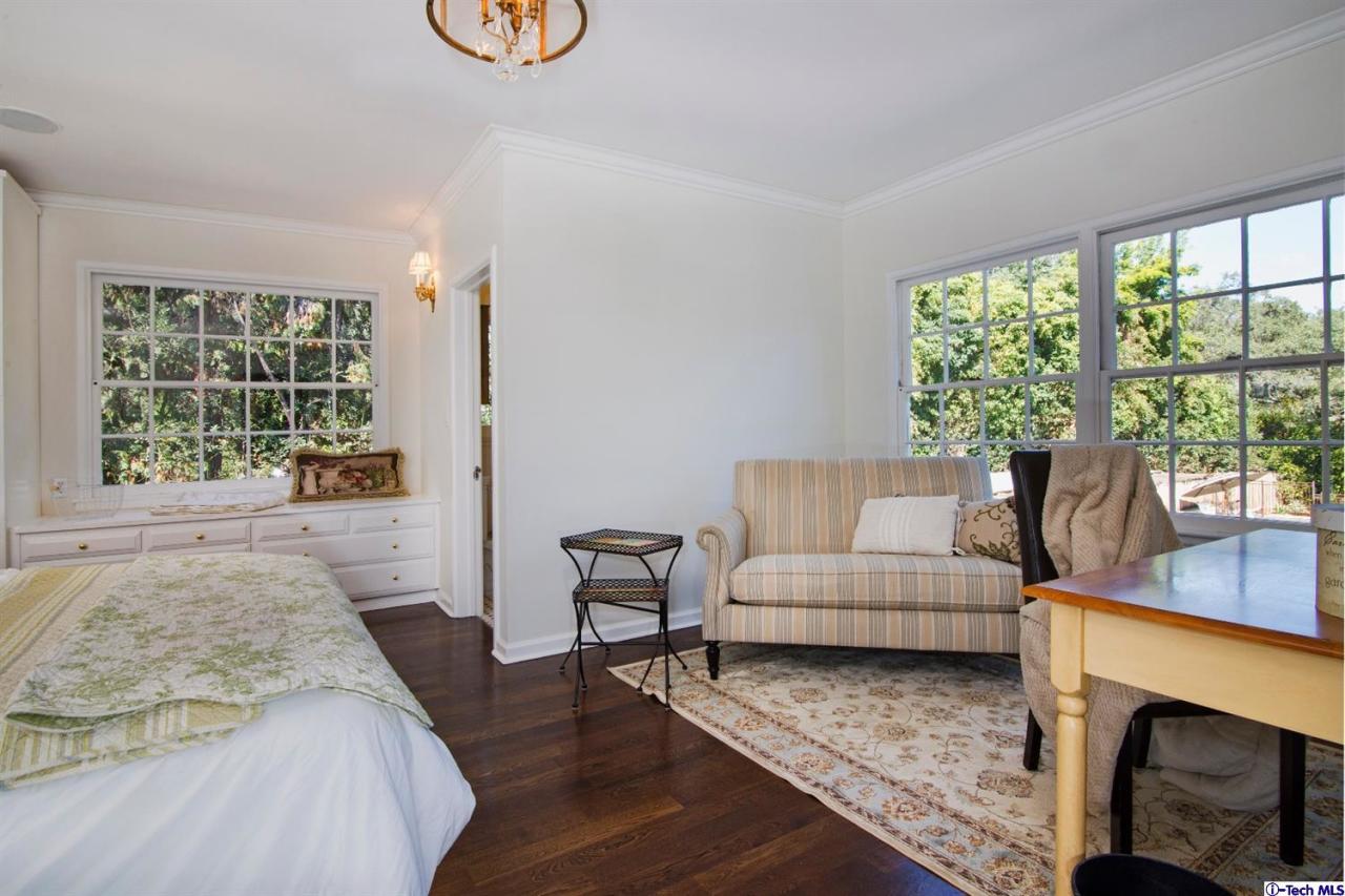 1814 Midlothian Drive Altadena, CA 91001 - Photo 27 of 42 a living room with furniture and a fireplace