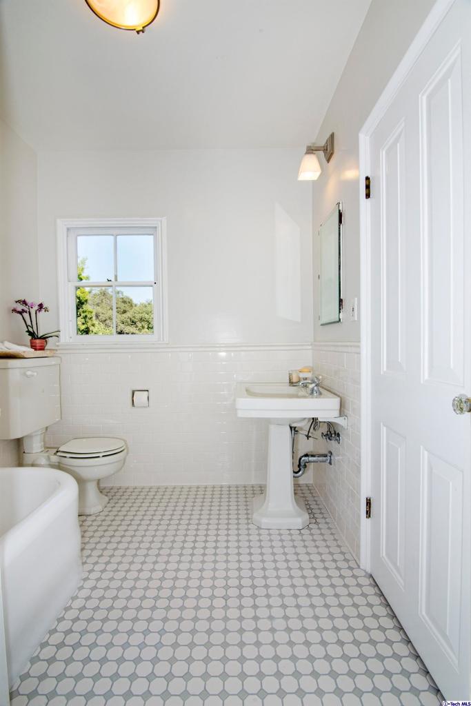 1814 Midlothian Drive Altadena, CA 91001 - Photo 31 of 42 a bathroom with a sink a toilet and a mirror