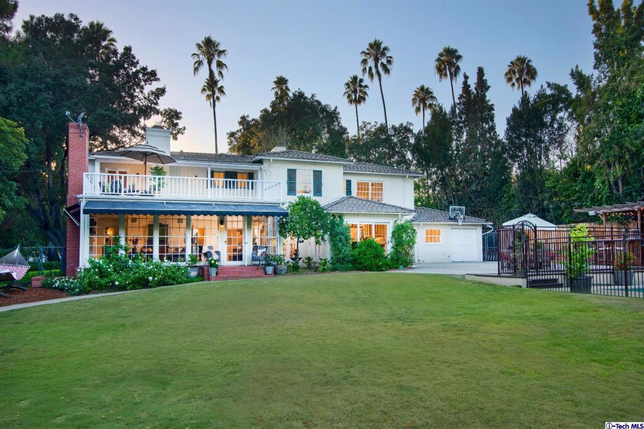 1814 Midlothian Drive Altadena, CA 91001 - Photo 32 of 42 a view of a house with a yard and potted plants