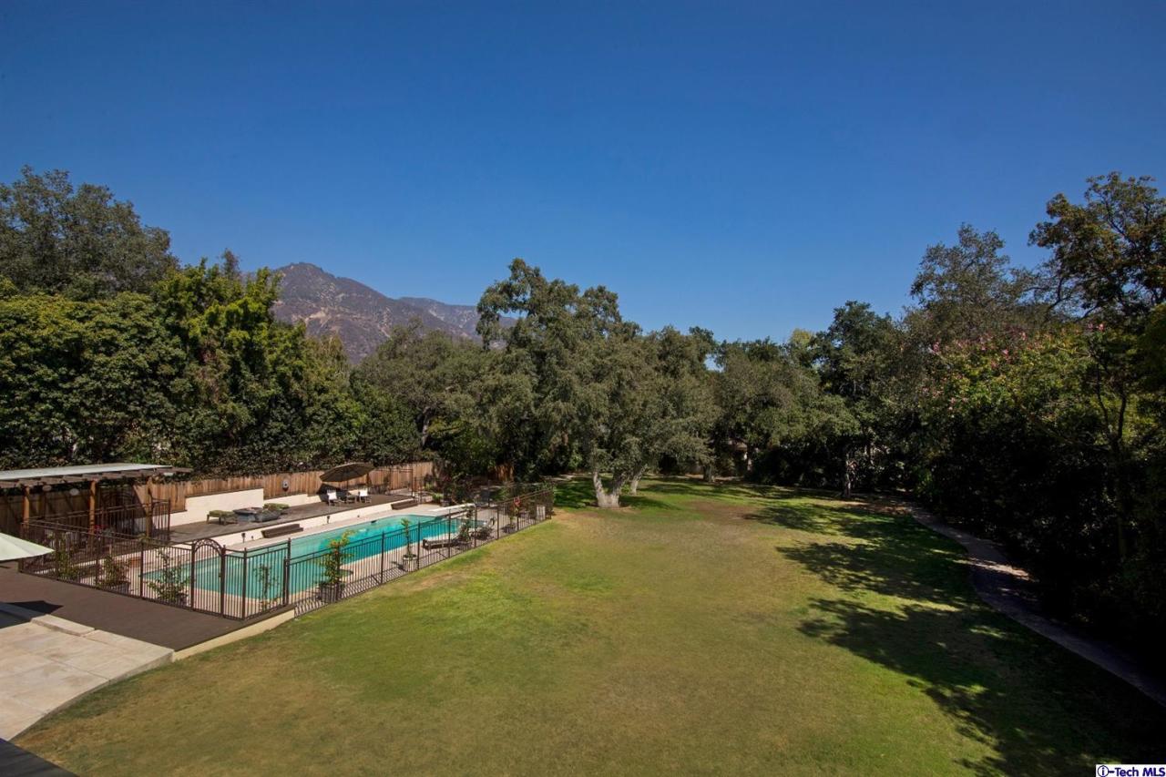 1814 Midlothian Drive Altadena, CA 91001 - Photo 37 of 42 a view of a yard with swimming pool and outdoor seating
