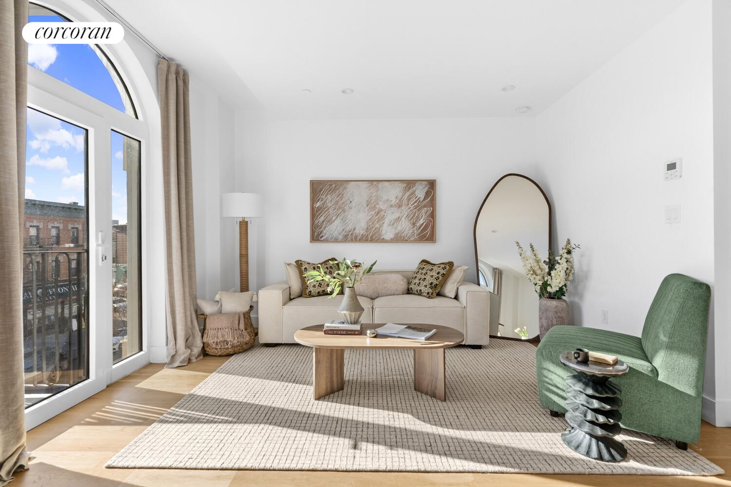 1105 Cortelyou Road, Unit 301 Brooklyn, NY 11218 - Photo 2 of 15 a living room with furniture a rug a lamp and windows