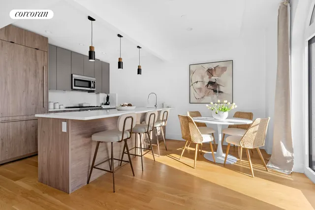 a kitchen with stainless steel appliances a sink stove and refrigerator